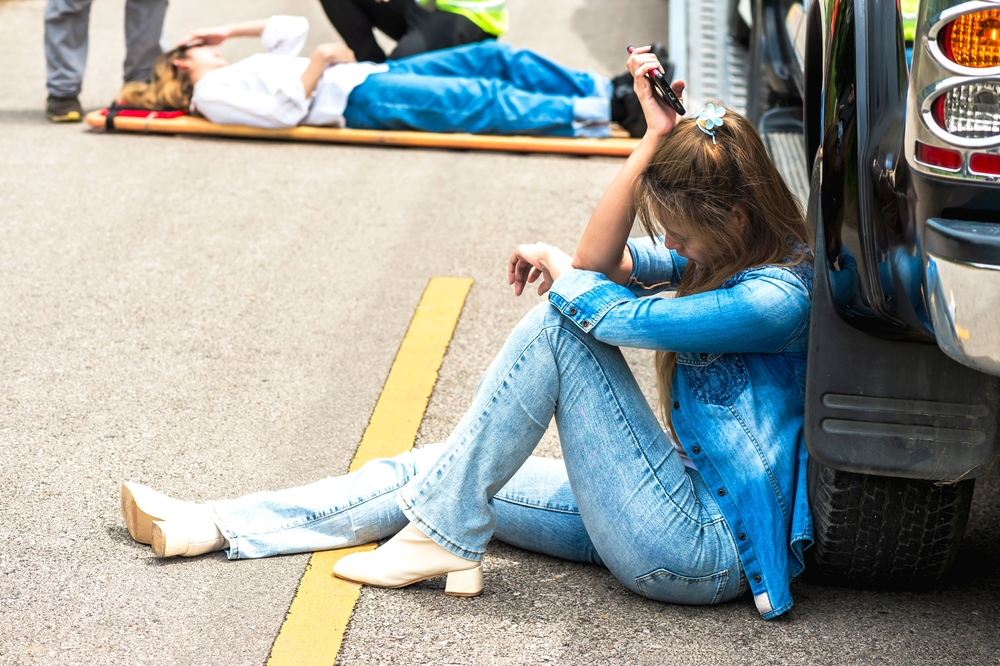 Young,Woman,Sitting,And,Feeling,Depress,With,Car,Accident,And