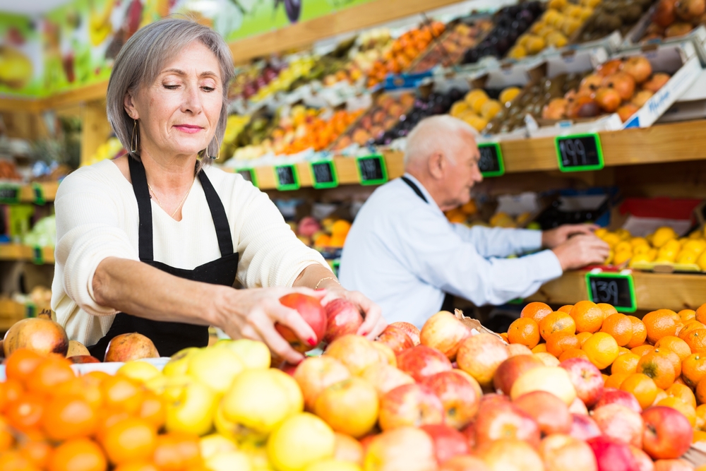 Old,Man,And,Woman,In,Aprons,Working,In,Salesroom,Of